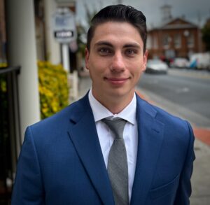 Headshot picture of Shawn Hogbin in a blue suit