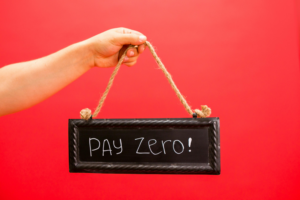 A hand holding a small blackboard sign with rope, reading "PAY ZERO!" in white handwritten letters, against a bright red background — promoting a free initial consultation.