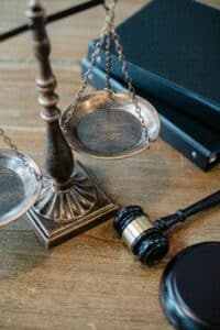 Scales of justice and gavel on desk symbolizing personal injury attorneys fighting for fair compensation.