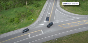 Aerial view of cars navigating a confusing multi-lane intersection, illustrating one of the most dangerous intersections where traffic merges and turns create high accident risk.