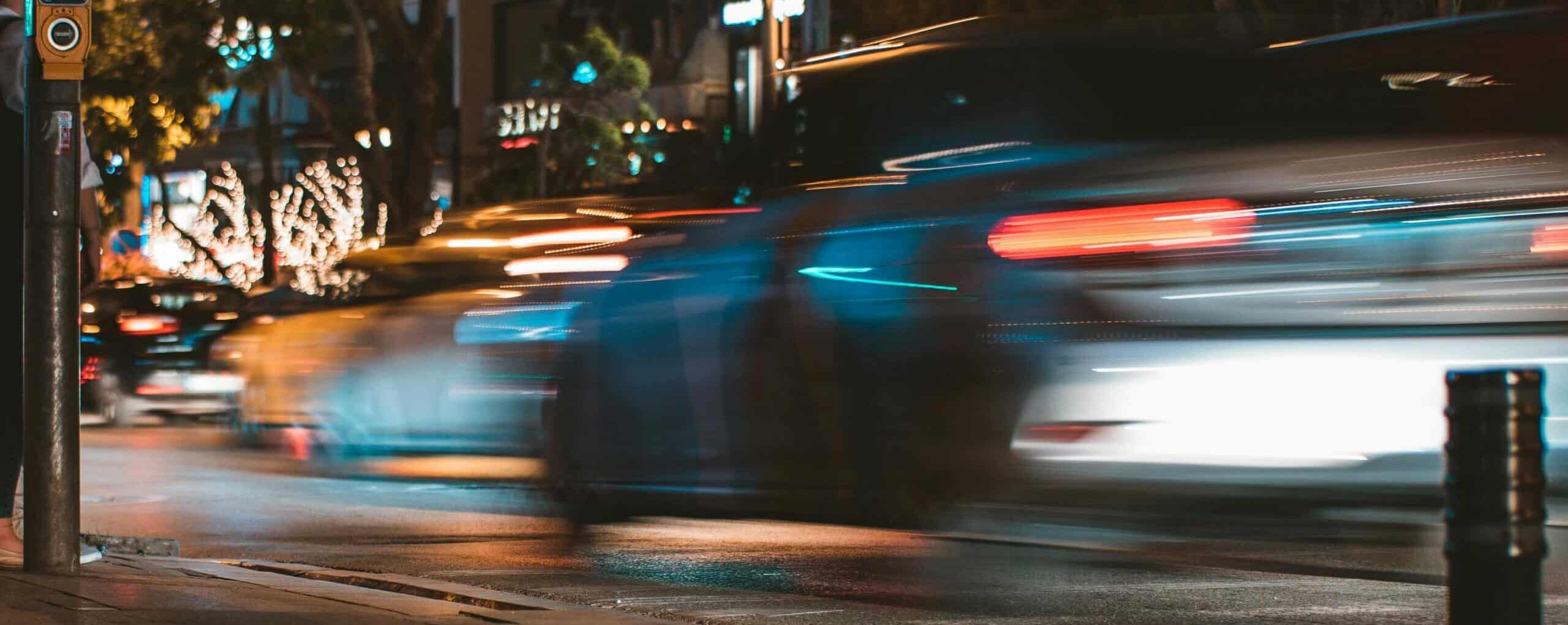 cars driving at night fast
