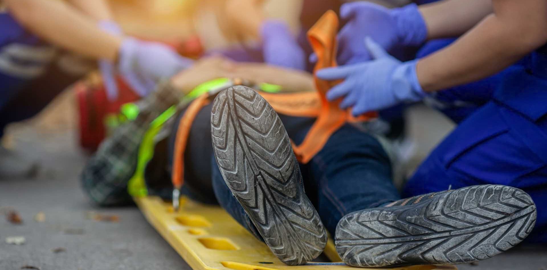 injured person being attended to by emts